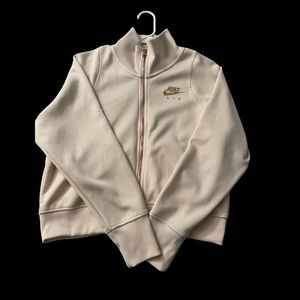 Pink Nike zip-up jacket.